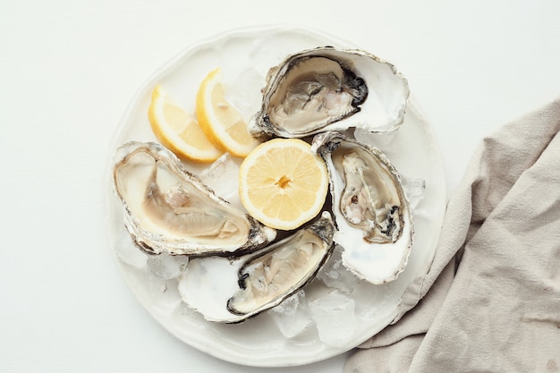 Free photo fresh oyster with lemon on a plate