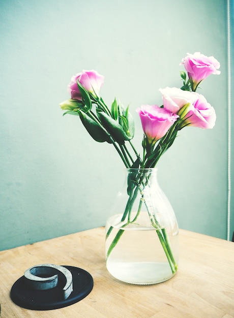 Fresh pink Lisianthus flowers in a jar