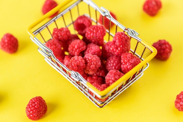 Free Photo fresh raspberries in a mini basket