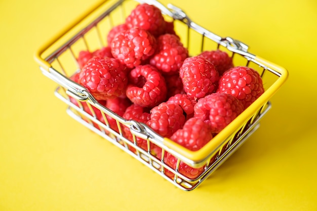 Free Photo fresh raspberries in a mini basket