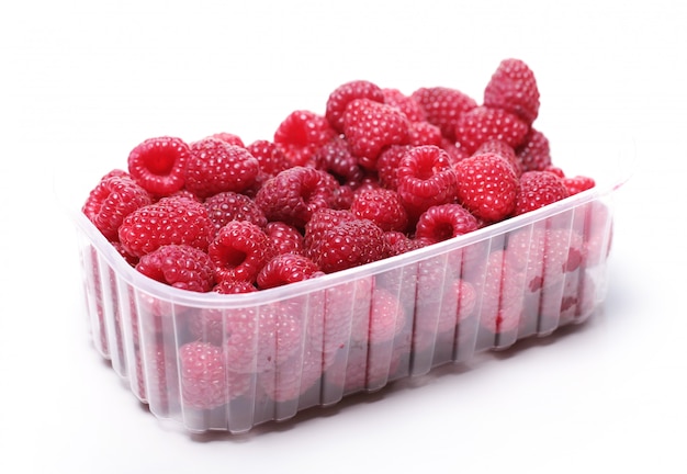 Fresh raspberries in the plastic box