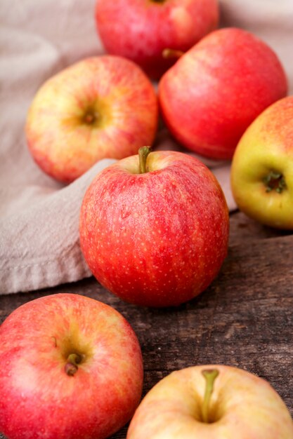 Fresh red apples on a wooden table