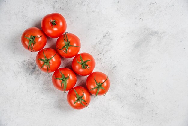 Fresh red tomatoes on a marble background