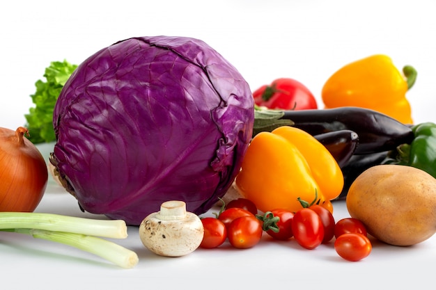 Fresh ripe colored vegetables on white background