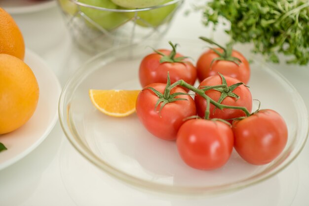 fresh ripe tomatoes on table