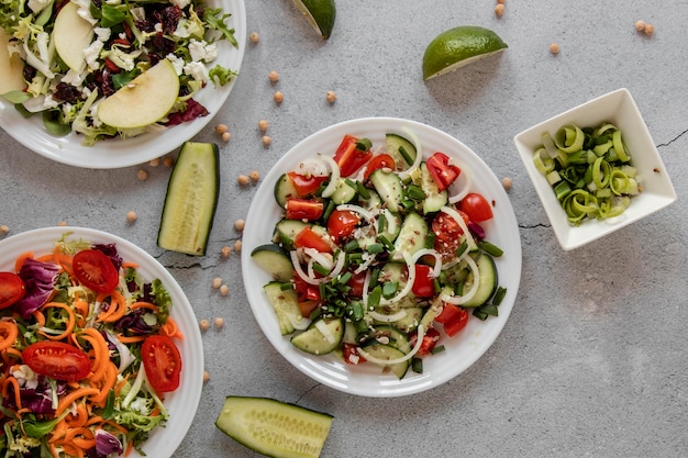 Fresh salad on table with avocado beside