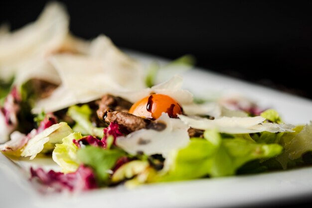 Fresh salad with cheese close up