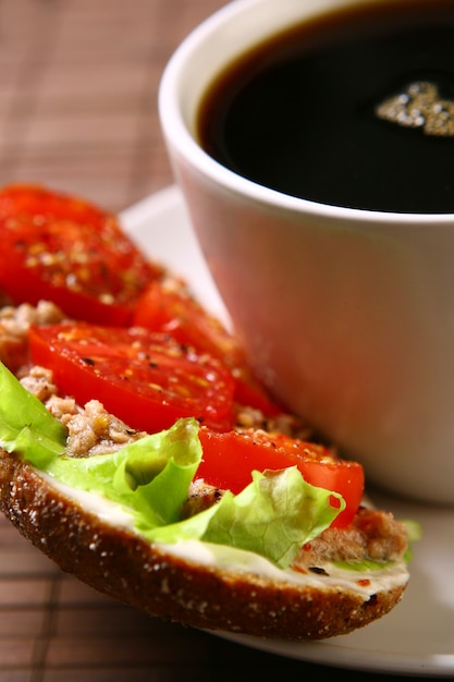 Fresh sandwich with fresh vegetables and coffee