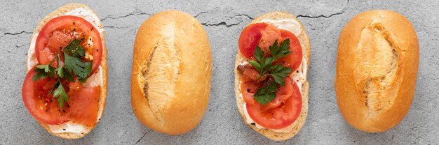 Fresh sandwiches arrangement on cement background