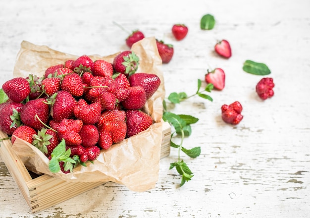 Fresh strawberries in a wooden box, concept of fresh summer berries