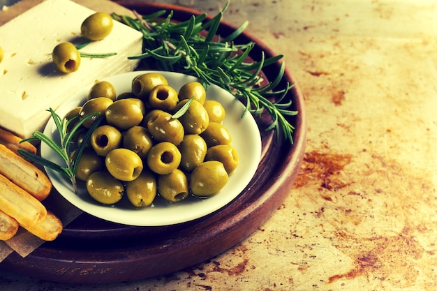 Free Photo fresh tasty greek green olives with cheese feta or goat cheese. closeup. mediterranean food.toning.