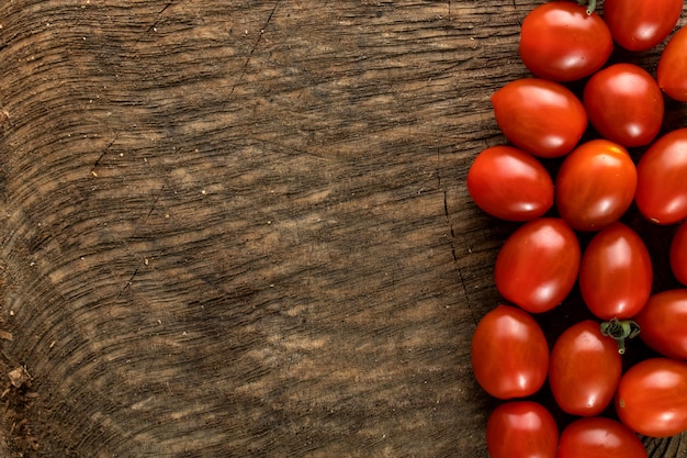 Fresh tomatoes on wooden desk