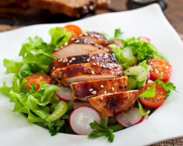 Fresh vegetable salad with grilled  chicken breast.