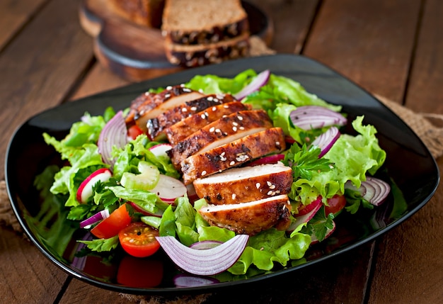 Fresh vegetable salad with grilled  chicken breast.