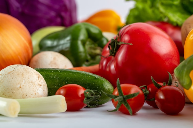 Free photo fresh vegetables colored ripe on white desk