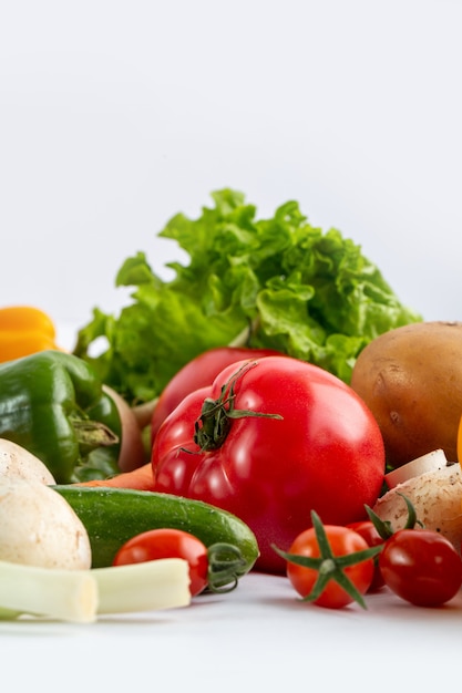 Fresh vegetables colored salad vegetabes on white background