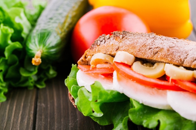 Free Photo fresh vegetables, salad, eggs and mushrooms lie between pieces of crusty wholemeal bread