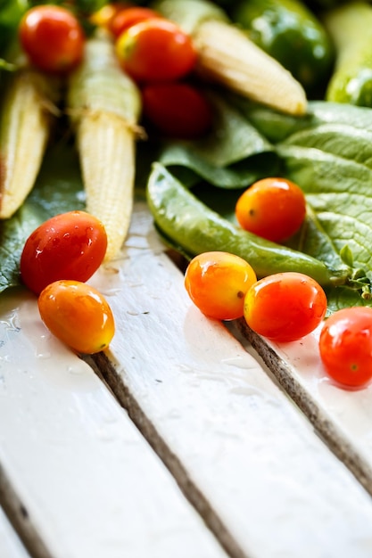 Fresh vegetables on a wooden board white