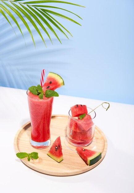 fresh watermelon juice or smoothie in glasses with watermelon pieces