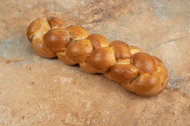 Fresh white bread on marble surface.