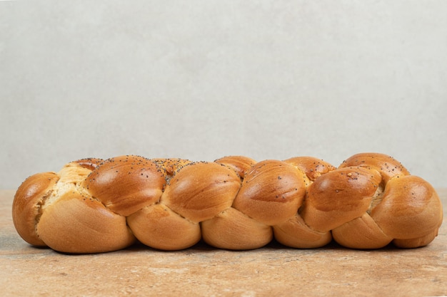 Fresh white bread on marble surface