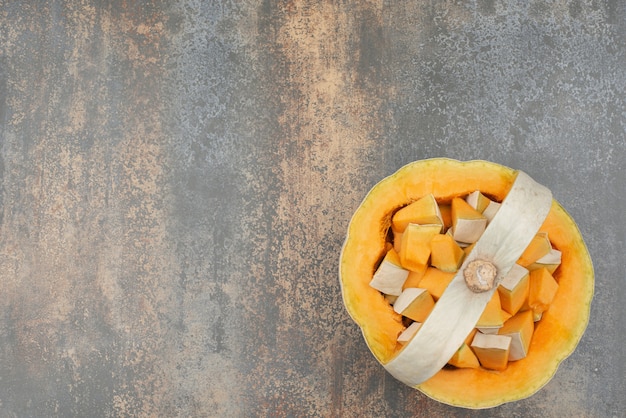 Free Photo fresh yellow pumpkin on marble surface