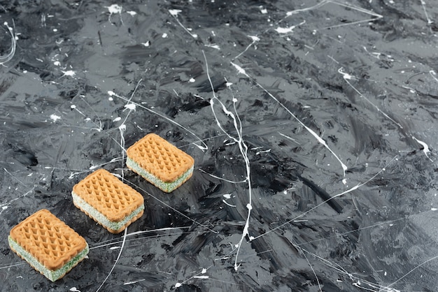 Freshly baked Belgian waffles isolated on a marble background. 