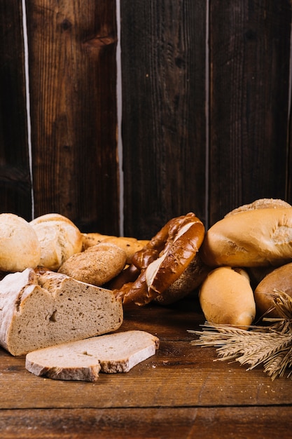 Freshly baked bread on wooden textured background