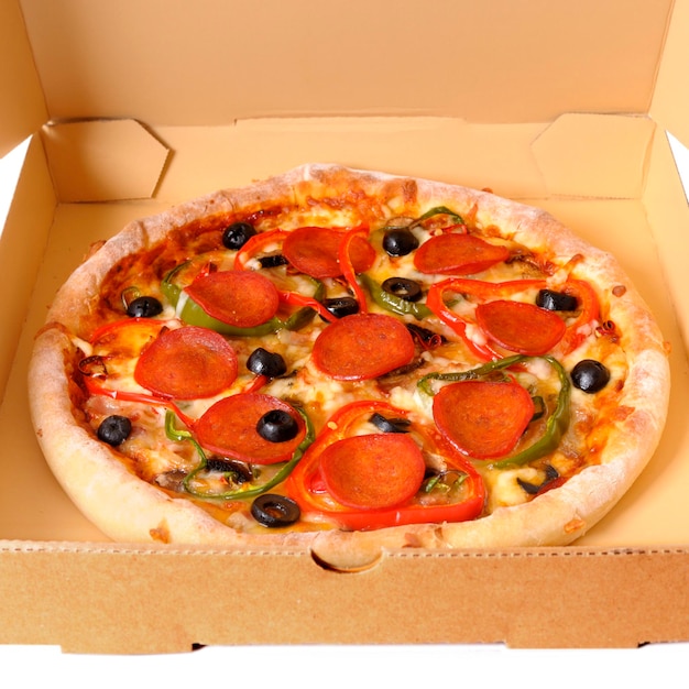 Freshly baked Italian pepperoni Pizza in a delivery box isolated on a white background.