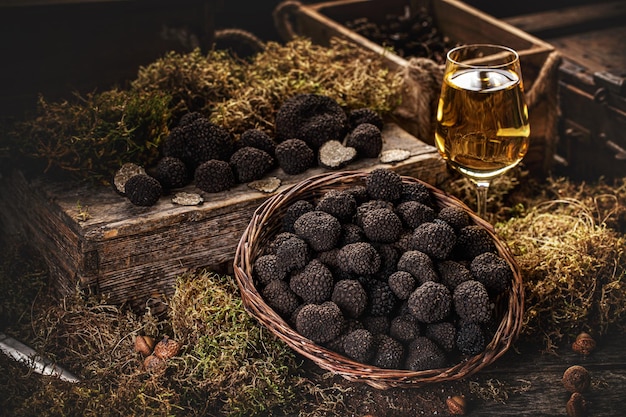 Free photo freshly picked black truffles on market table with very fancy decoration