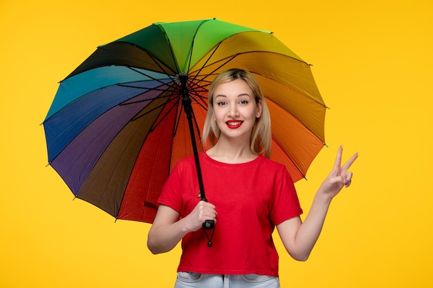 Free photo frevo cute blonde girl celebrating brazilian festival showing peace