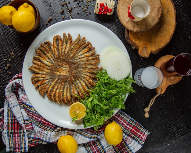 Fried anchovies with lemon and herbs.