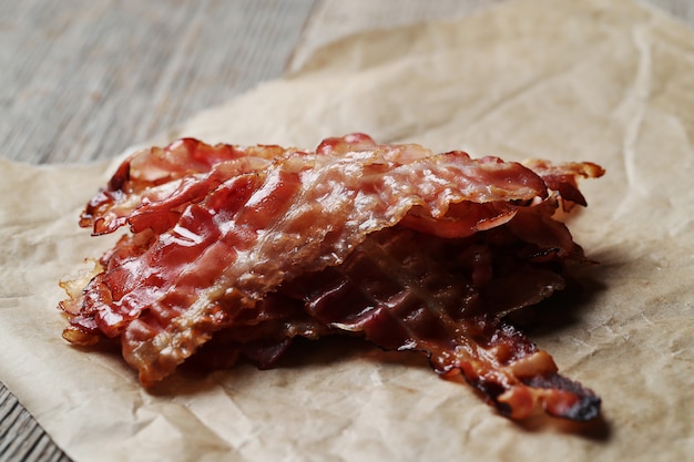 Free Photo fried bacon on brown paper