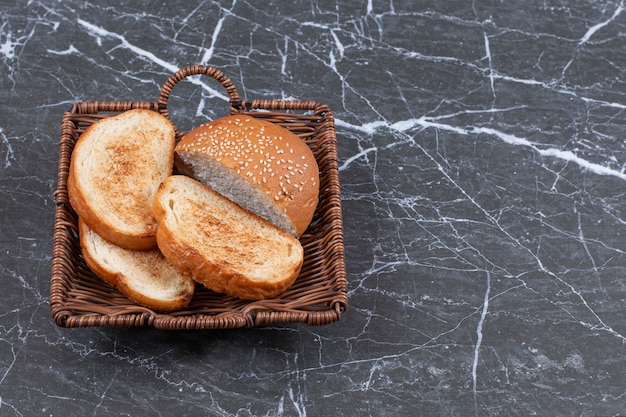 Fried bread and bun in the wicker basket.