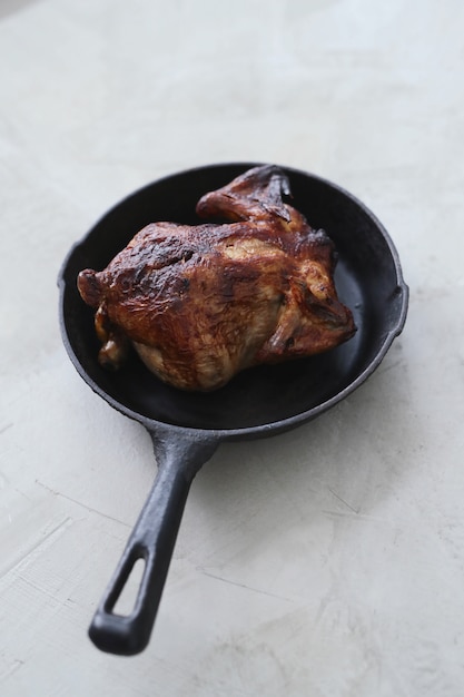 Fried chicken in black pan