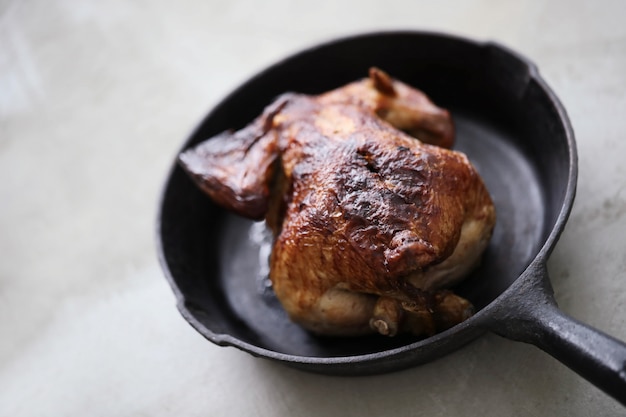 Fried chicken in black pan