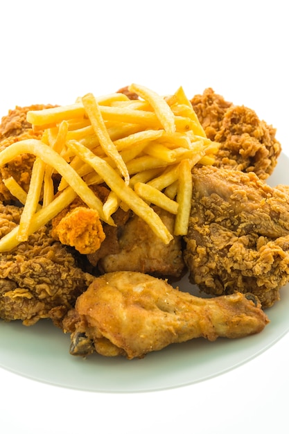 Free photo fried chicken and french fries in white plate