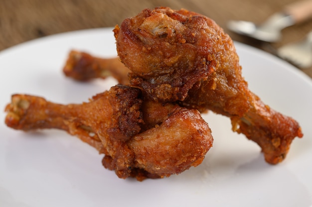 Free Photo fried chicken legs on a white plate