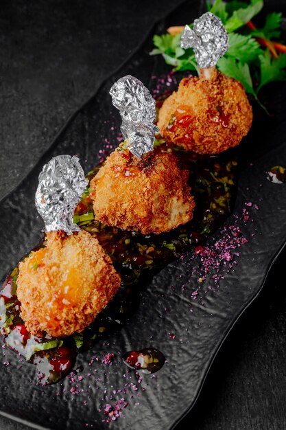 Fried chicken served with barberry sauce and parsley