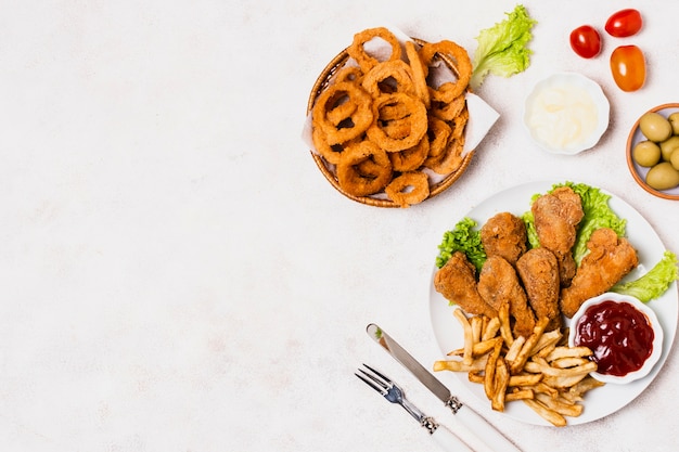 Fried chicken with fries and copy space