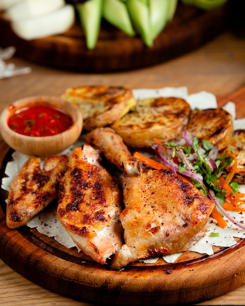 Fried chicken with potatoes on the table