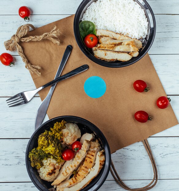 fried chicken with rice and vegetables