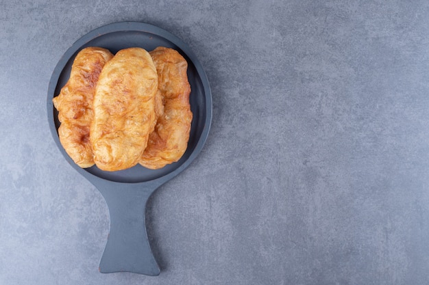 Fried dough in a pan