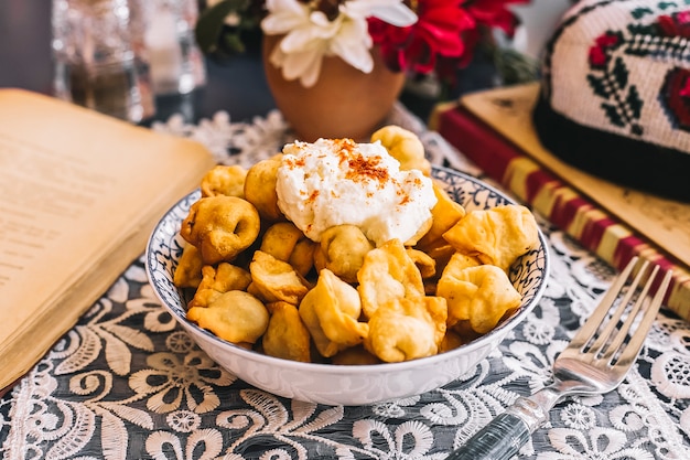 Fried dushbara dumplings bowl served with yogurt