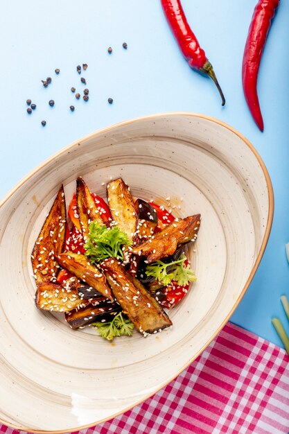 Fried eggplant topped with sesame seeds