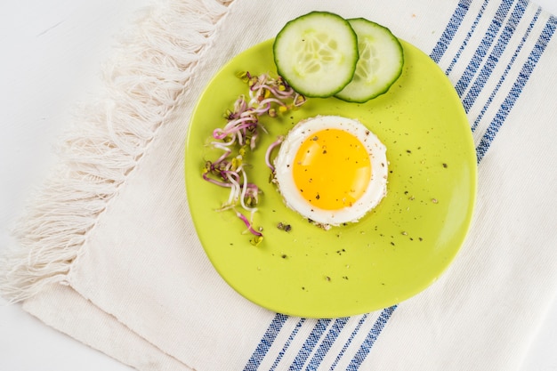 Fried eggs with cucumber