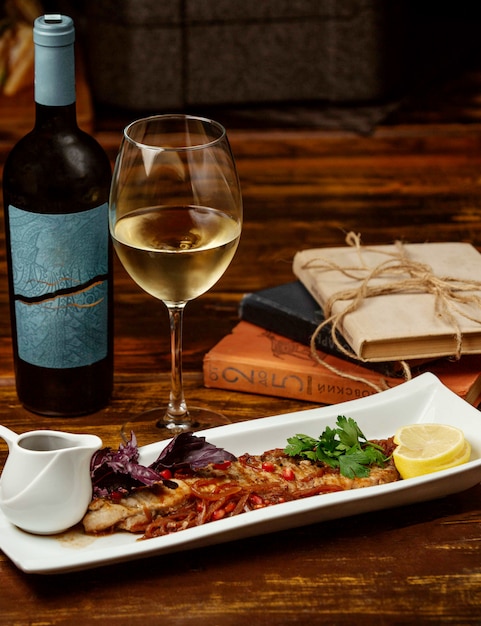 Fried fish with pomegranate lemon and white wine