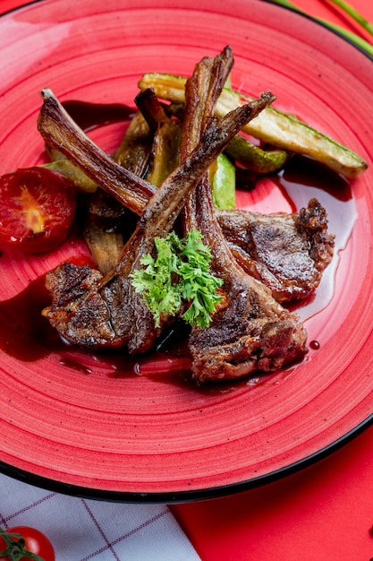 Fried lamb ribs with vegetables