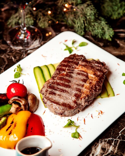 Fried meat piece and vegetables with fried mushrooms