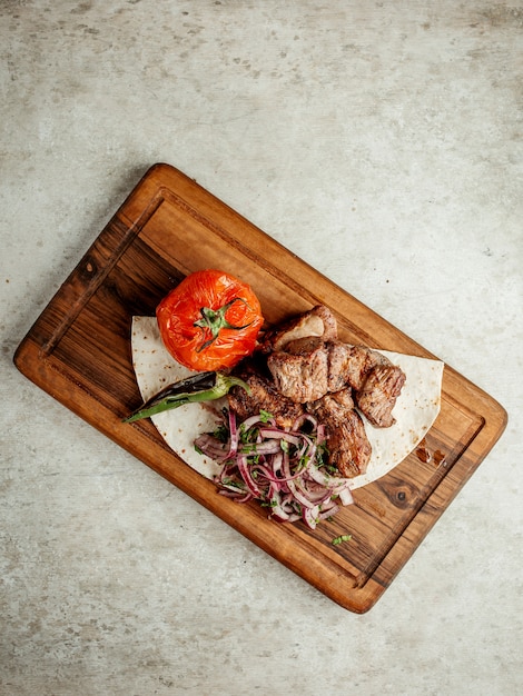 Fried meat pieces with vegetables